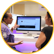 Employee demonstrates ModMed software on a desktop computer during MIPS Advising session
