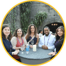 MOMENTUM attendees at the Specialty Networking Reception enjoying the event and smiling for the camera.