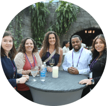 MOMENTUM attendees at the Specialty Networking Reception enjoying the event and smiling for the camera.