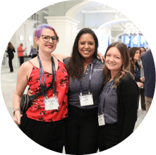 Several MOMENTUM attendees posing for the camera while enjoying the outdoor Welcome Reception
