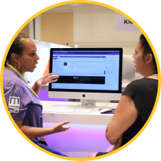 Employee demonstrates ModMed software on a desktop computer during MIPS Advising session