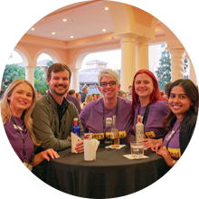 MOMENTUM attendees at the Specialty Networking Reception enjoying the event and smiling for the camera.