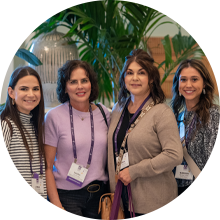 Several MOMENTUM attendees posing for the camera while enjoying the outdoor Welcome Reception