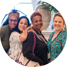 Several MOMENTUM attendees posing for the camera while enjoying the outdoor Welcome Reception